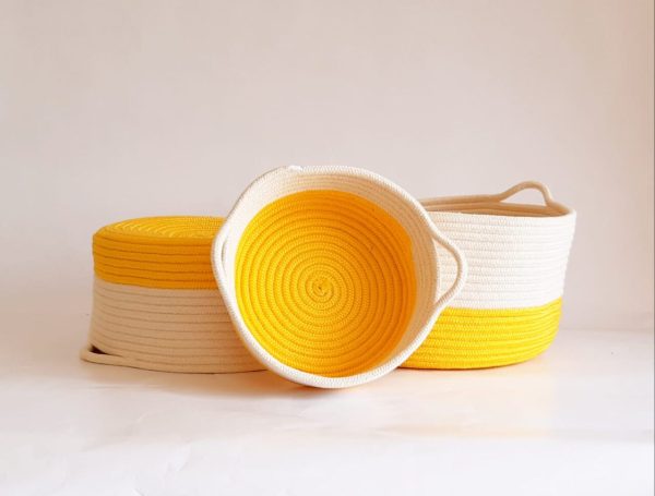 set of yellow cotton silk baskets